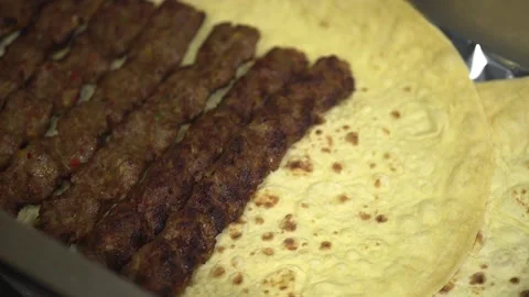 Grilled Kebabs with Flatbread Stock Footage 319949077