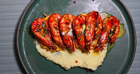 Grilled King Prawns with Mashed Potato Puree on Plate in Restaurant Stock Footage 347703538