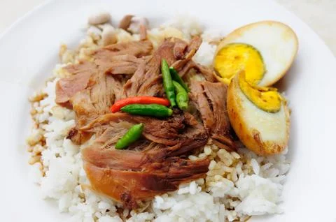 Grilled knuckle of pork on rice 스톡 사진