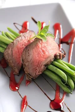 Grilled lamb chops with green beans on plate Stock Photos