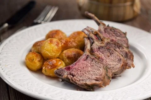 Grilled lamb chops with potatoes. High quality photo. Stock Photos