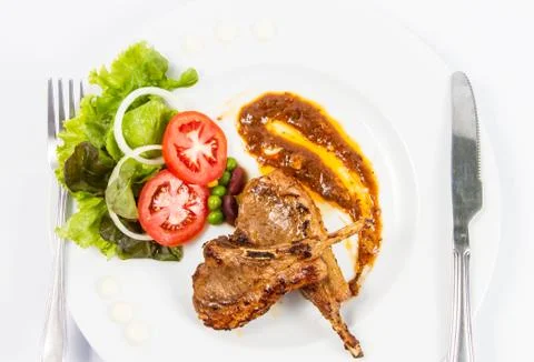 Grilled lamb chops  with vegetables Foto stock