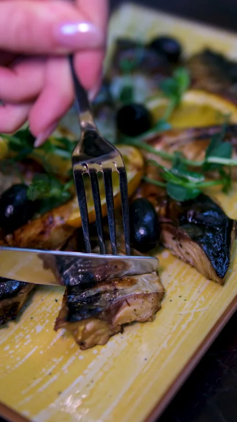 Grilled mackerel fish fillet on a grill. Black background. Top view. Stock Footage 319444265