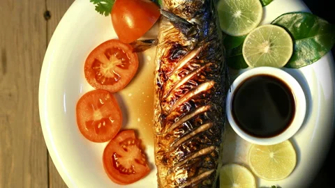 Grilled Mackerel Fish rotating with sauce and vegetables,top view,Japanese Fo Video stock 234168247
