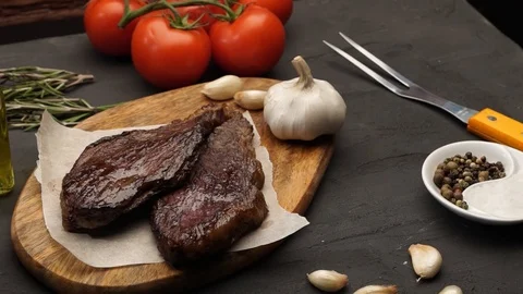 Grilled meat and vegetables on rustic wooden table. Barbecue menu Video stock 115830757