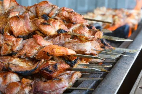 Grilled meat on a barbecue Stock Photos