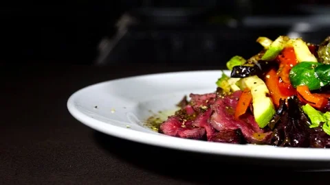 Grilled meat : beef lamb garnished with tomatoes ,tomatoes Stock Footage 74796959