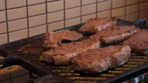 Grilled meat on the grill Stock Footage 130267585