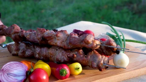Grilled meat on the grill with open fire. Shashlik, traditional Georgian food Stock Footage 302602388