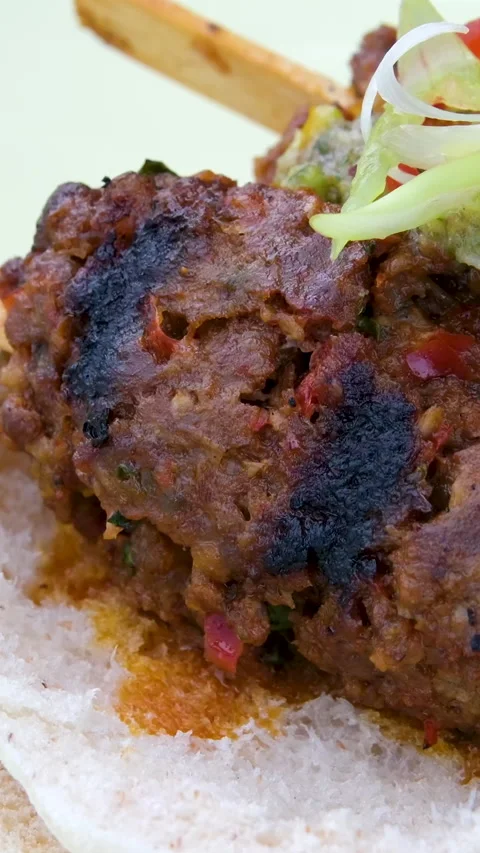 Grilled meat on the grill with open fire. Shashlik, traditional Georgian food Stock Footage 306761630