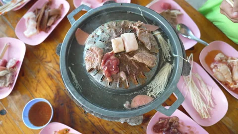 Grilled meat on pan for party of people, grill pork food on hot pot and soup 動画素材 203761753
