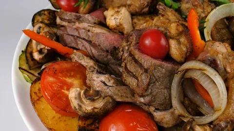 Grilled Meat platter, chicken wings, veal, pork, potatoes and grilled vegetables Stock Footage 87568106