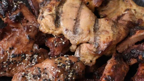 Grilled meat set featuring chicken breast, wings, and ribs seasoned with spices. Stock Footage 345108772