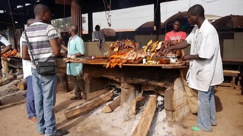Grilled meat stall on market Stock Footage 80424491