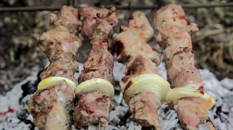 Grilled meat twist on fire Stock Footage 50396103