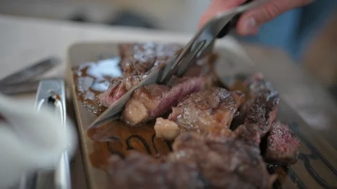 Grilled meat with vegetables on a board Stock Footage 195413194