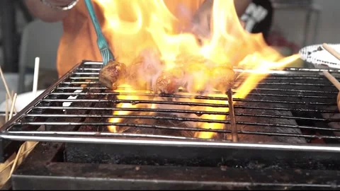 Grilled meatballs until the fire comes out in the roast Stock Footage 265934288