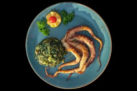 Grilled octopus with vegetables Stock Photos
