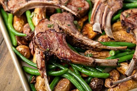 Grilled or roasted lamb chops with green beans and potatoes Stock Photos