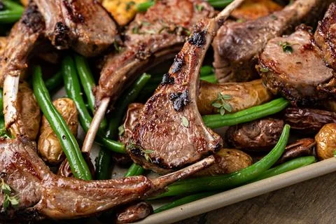 Grilled or roasted lamb chops with green beans and potatoes Stock Photos
