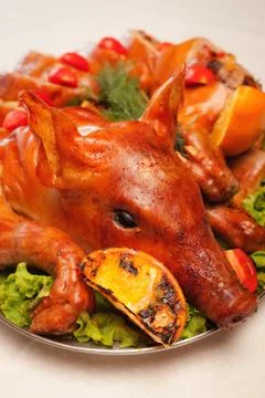 Grilled pig on a plate Stock Photos