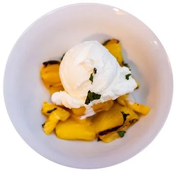 Grilled pineapple slices complemented with vanilla ice cream Stock Photos