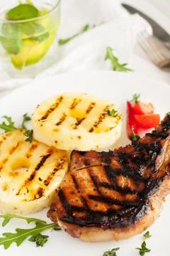 Grilled pork chops with pineapple Stock Photos