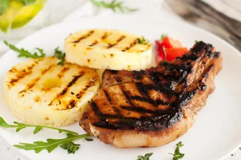 Grilled pork chops with pineapple Stock Photos