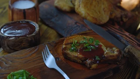 Grilled pork chops on wood Stock Footage