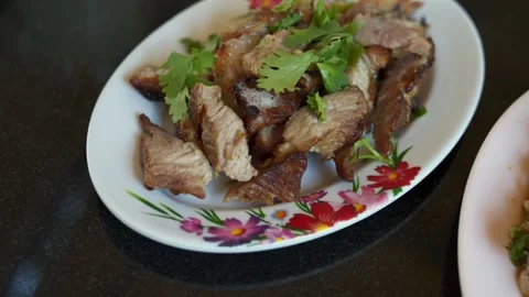 Grilled pork neck in a white plastic plate on a black marble table Stock Footage 275592389