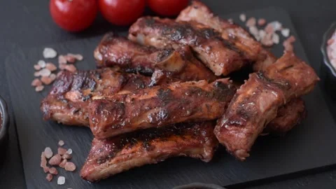 Grilled pork or beef ribs seasoned with salt and spices, served in sauce. Grille Stock Footage 345108753