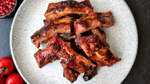 Grilled pork or beef ribs seasoned with salt and spices, served in sauce. Grille Stock Footage 345108905