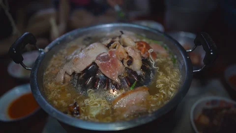 Grilled pork on pan, close up meat slice on hot pan, vegetable in hot soup 動画素材 129114159