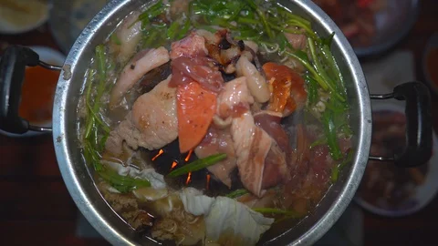 Grilled pork on pan, close up meat slice on hot pan, vegetable in hot soup Stock Footage 129114318