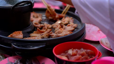 Grilled pork piece and seafood on hot pan for cooking food in party Stock Footage 130225341