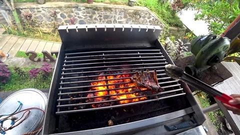Grilled pork ribs, grilled on fire Stock Footage 106558576