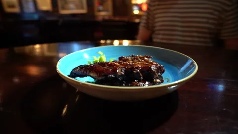 Grilled pork ribs On a plate Video stock 131885671