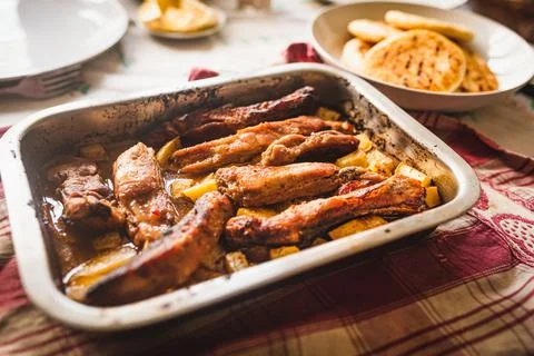 Grilled pork ribs on table inside oven aluminum container with venezuelan are 스톡 사진