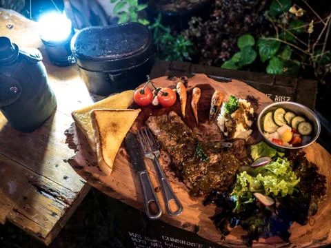 Grilled pork steak with Pickles, vegetables salad and mash potato in the camp Stock Photos