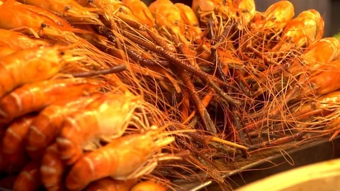 Grilled prawns on stall in restaurant Stock Footage 101728399