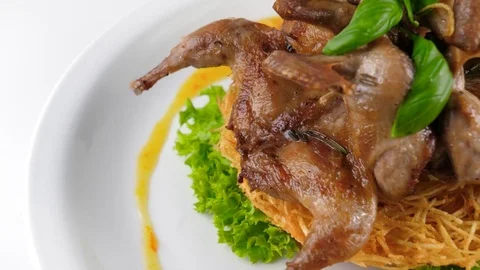 Grilled quails with potatoes and vegetables, gourmet food 動画素材 80142407