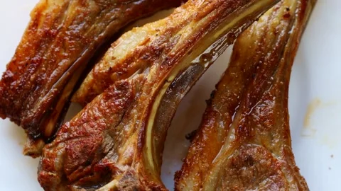 Grilled rack of lamb barbecue circle rotation close up top view Stock Footage 268857922