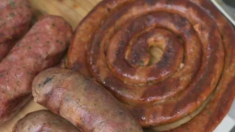 Grilled with rib of beef, chistorra and sausages. Golden sausages Stock Footage 155304465