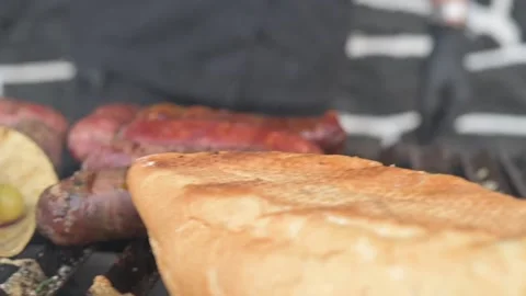 Grilled with rib of beef, chistorra and sausages. Golden sausages Stock Footage 155304486