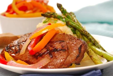 Grilled rib-eye steak with mashed potatoes Stock Photos
