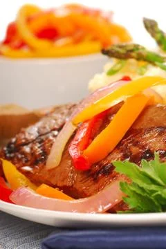 Grilled rib-eye steak with mashed potatoes Stock Photos