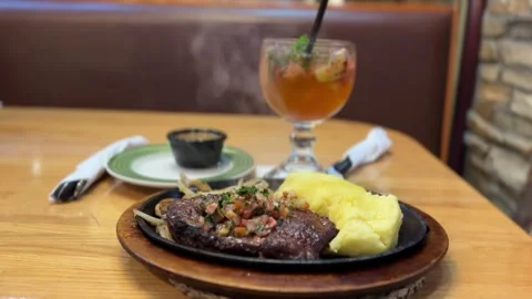 Grilled ribeye steak with a side of mashed potatoes Stock-Footage 282783498