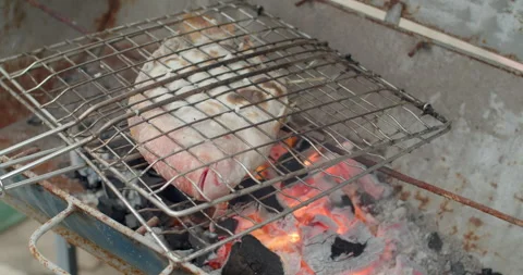 Grilled ruby ​​fish with salt.Grilled ruby ​​fish with salt is a food that Thai  Stock Footage 281009181