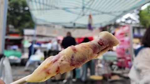 Grilled Rushan Cheese with Rose Jam at a Local Food Stall in Dali, Yunnan, .. Stock Footage 340516685