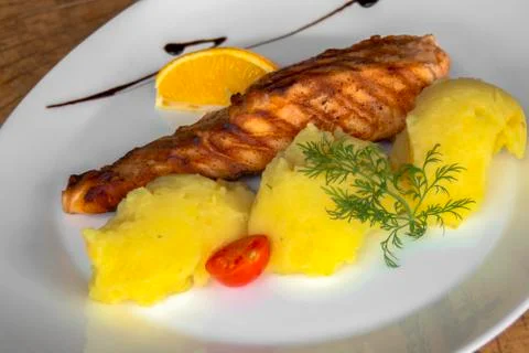 Grilled salmon fillet with mashed potatoes.  Closeup. Stock Photos
